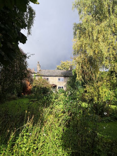 Lush gardens in front of Goytside Farmhouse